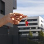 hand-holding-keys-outdoors